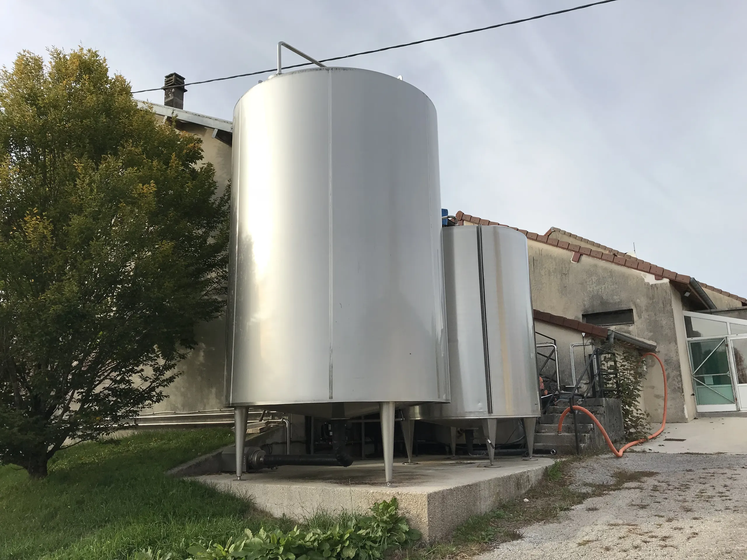 Steel milk tanks outside a dairy.